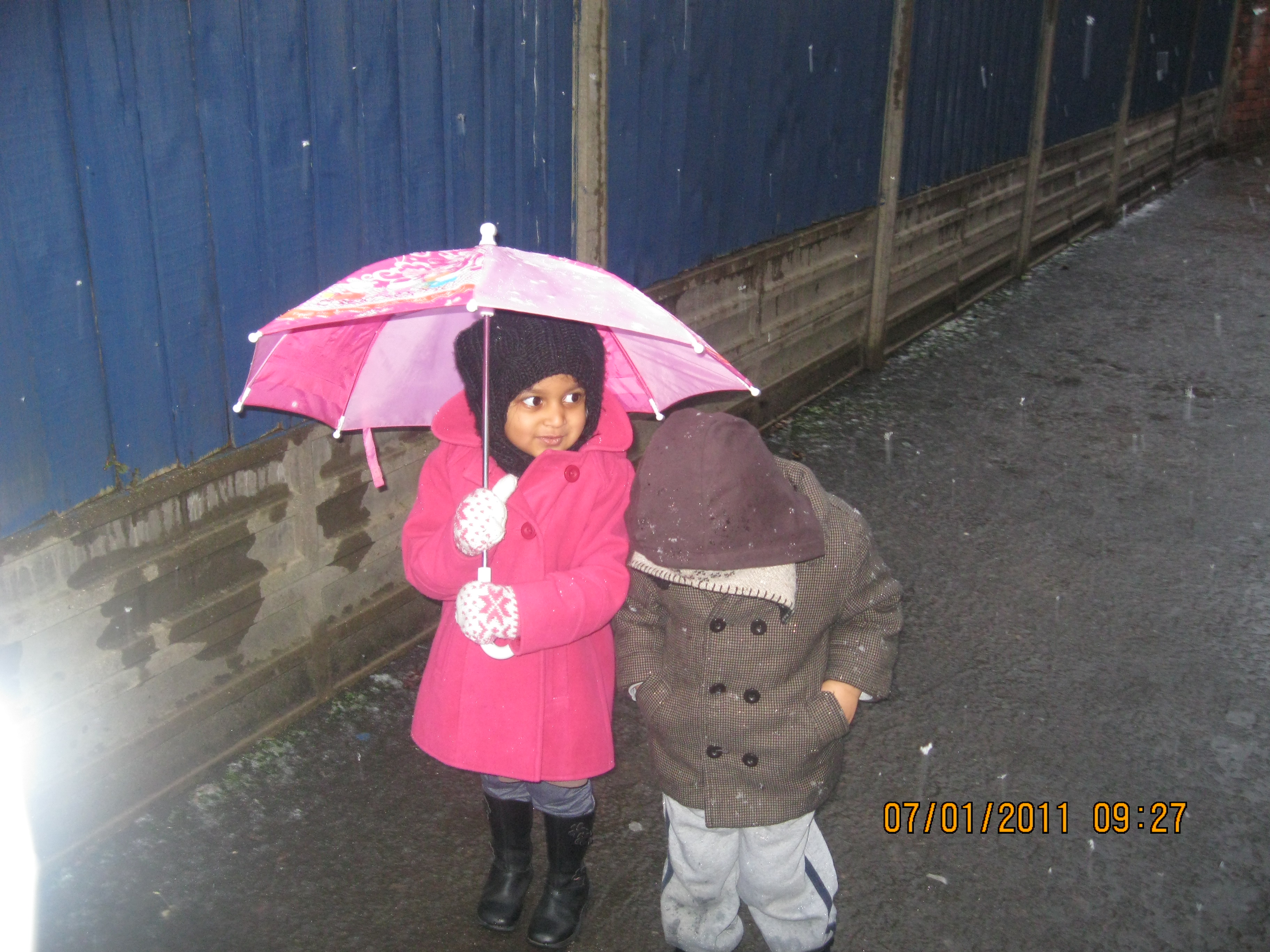 Girl with an umbrella at Early Learners' Nursery School, Leicester